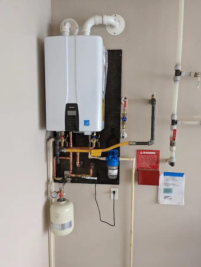 Professional plumber installing copper piping in a Rosemead home